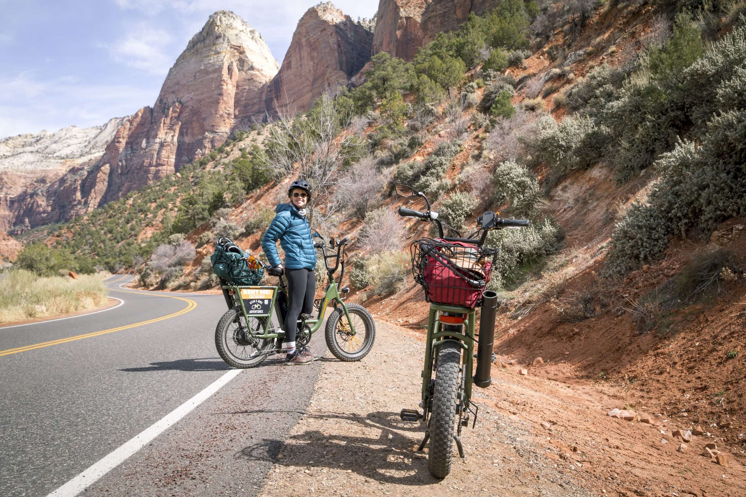 Woman with full backpack posing on an eBike